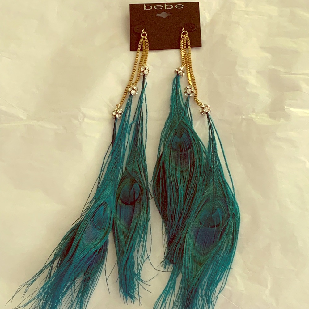 BEBE RARE, NWT Feather duster earrings, 12” long.